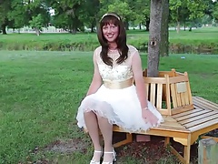 Crossdressing Princess sitting in the Park